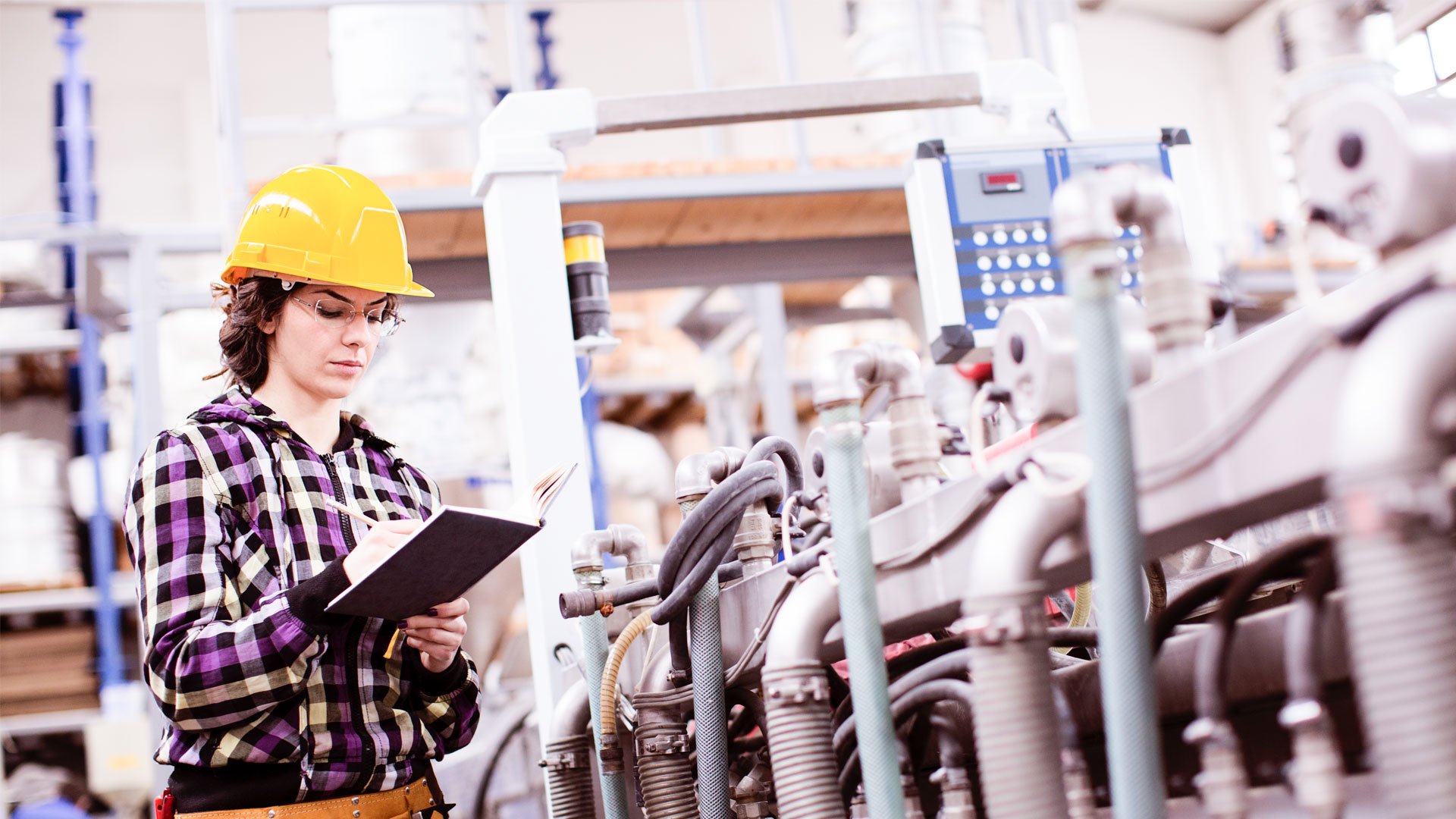 Technician checking machinery